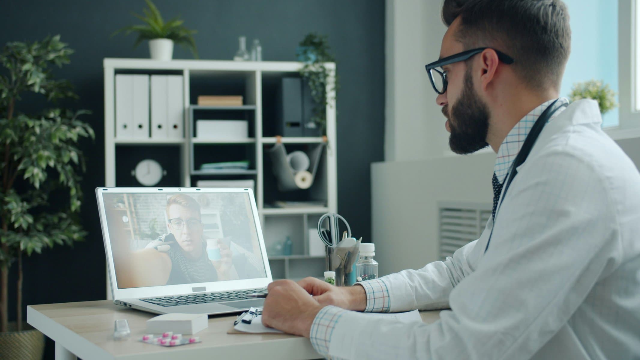 Doctor with patient reviewing data